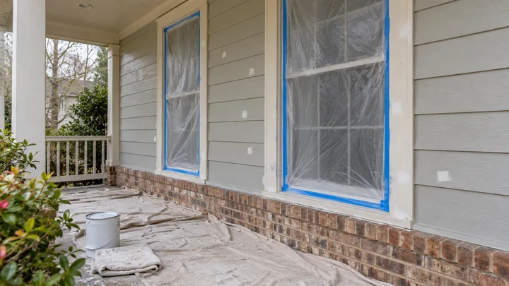 AI concept: porch windows masked and floor protected for painting