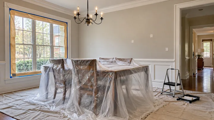 AI concept: furniture covered and oak floors protected before painting